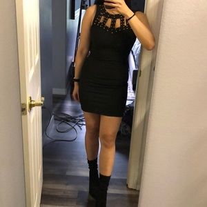 Black dress with gold stud detailing on chest